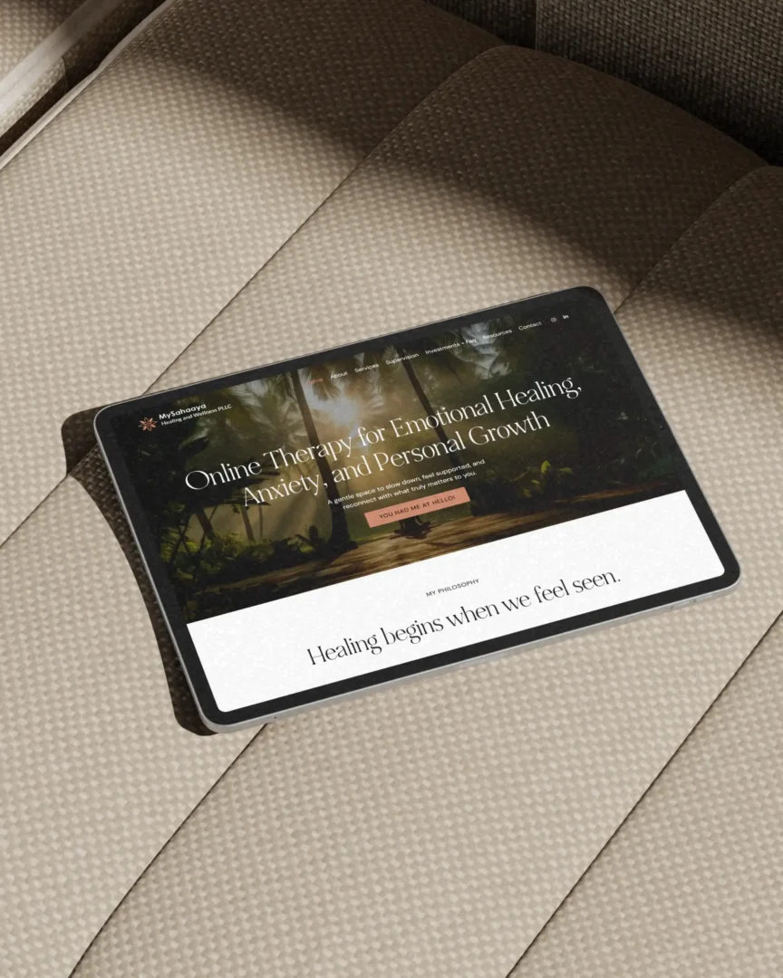 Tablet displaying a therapist website design with an elegant nature-inspired homepage