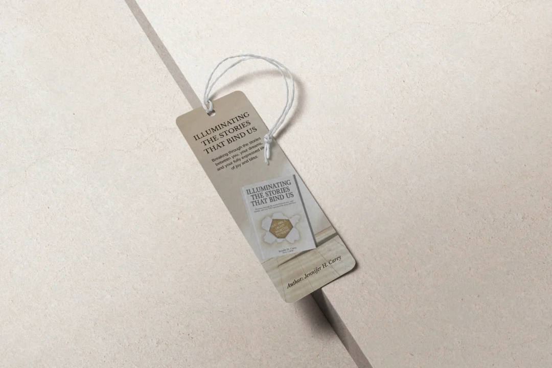 Branded bookmark featuring minimalist typography and a small hanging tag on a neutral background